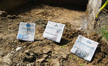 three newspapers near pit