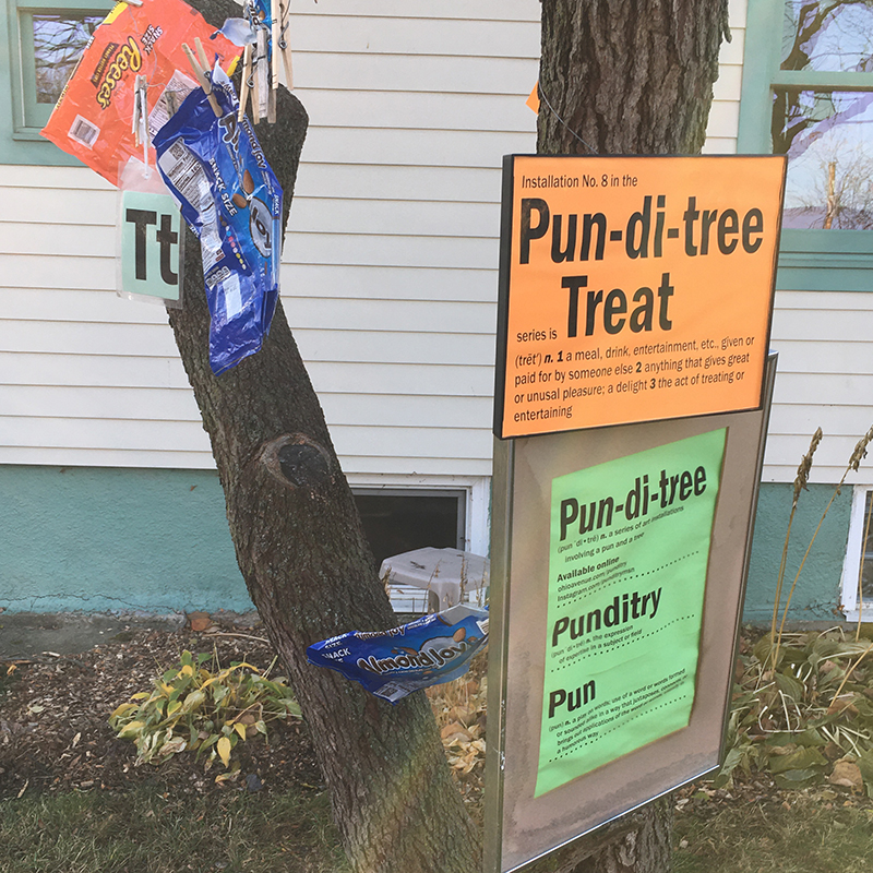 signs, letter T and candy bags hanging from tree