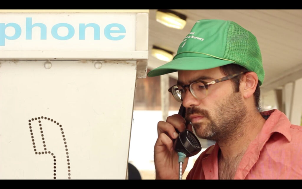 Zach Kmiec as Mark makes a telephone call in "Heads Up," a film by Zach Kmiec and Francis Zaander that will be shown at the 53704 Frame by Frame Film Festival on Novembe 4, 2023, at the Barrymore Theatre in Madison, Wisconisn.
